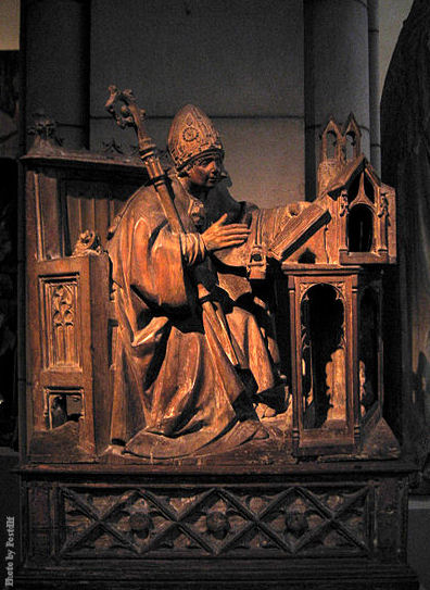 St. Ambrose in His Study, ca. 1500. Spanish. This wood carving is at the Metropolitan Museum of Art, New York City.
