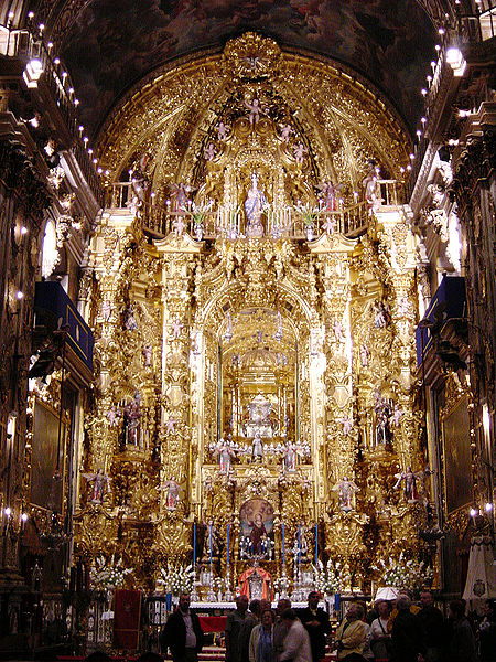 Baroque main altarpiece in San Juan de Dios basilica, at Granada, Spain, with the shrine of saint John of God.